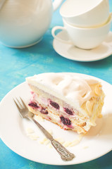 biscuit cake with cream and a cherry