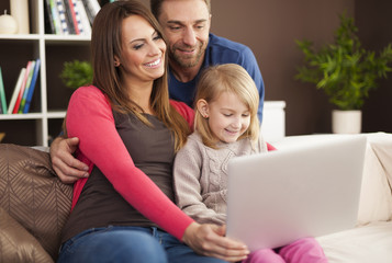 Happy family enjoying of modern technology