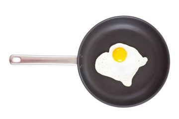 fried egg in frying pan on white background