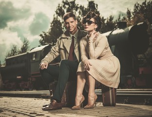 Vintage couple on train station platform