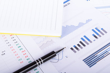 Financial Charts and Graphs on Business Table