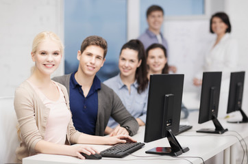 Fototapeta premium students with computer monitor at school