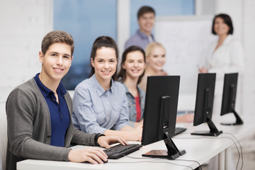 students with computer monitor at school