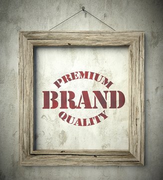 Premium brand emblem in old wooden frame