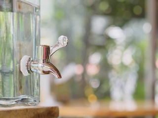 the faucet with the clear flask