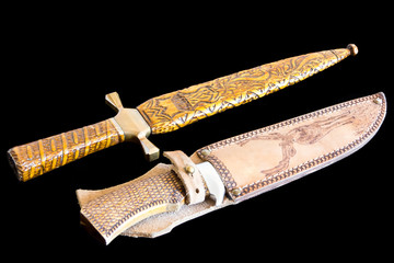 Cold weapon on black background