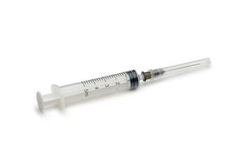 Fototapeta premium Plastic disposable syringe with a needle in the protective cap