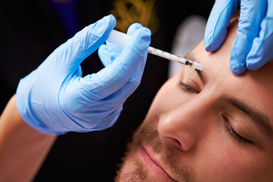 Man Having Cosmetic Injection Treatment at Beauty Clinic