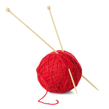Red ball of wool and knitting needles isolated on white backgrou