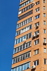 blue sky and wall of multistorey house