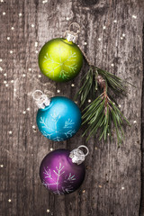 Christmas decoration ball on textured grungy wooden surface
