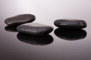 Spa stone arrangement on black surface