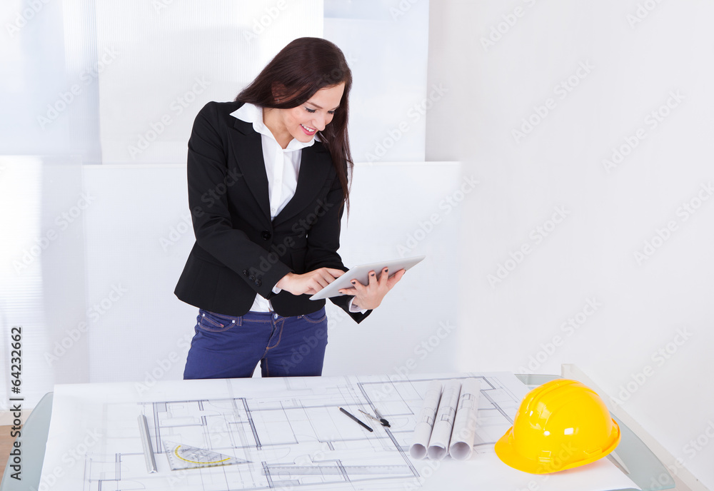 Aufkleber architect with digital tablet standing at desk