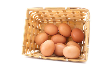 Egg collection in the basket isolated on white