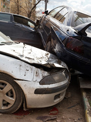 three broken cars during road accident