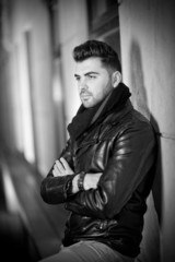 Obraz premium Top view of handsome male model in leather jacket posing 