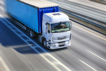 Fototapeta truck moves on highway obraz
