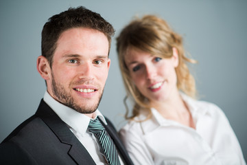 handsome young executive business man with female coworker