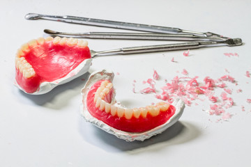 Wax dentures model. table of dental technician workplace.