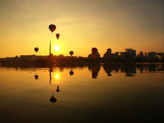 reflection hot air ballon at sunrise