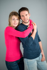 portrait of a cheerful young couple relaxed at home
