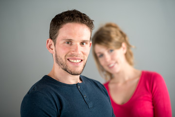 portrait of a cheerful young couple relaxed at home