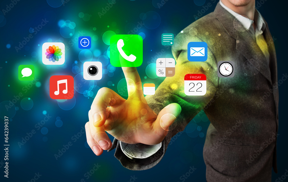 Wall mural handsome businessman pressing colorful mobile app icons with bok