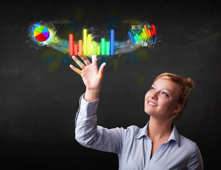 Young businesswoman touching colorful modern graph system concep
