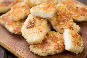 Roasted chicken nuggets, close-up, horizontal shot