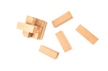 jenga tower colapsing on a white background