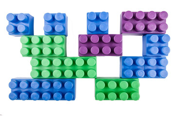 building blocks pieces joining on a white background