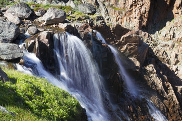 Mountain lake in the North. Moss-covered hills, and stunted vege