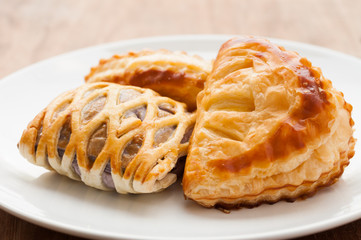 homemade fresh fruit pies on a tray