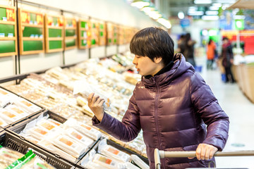 Young woman shopping in the supermarket