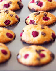 Delicious muffins placed in black tray