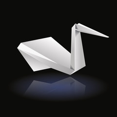 White origami bird front on dark background
