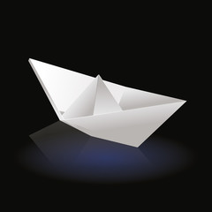 White origami boat on dark background