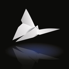 White origami butterfly side on dark background
