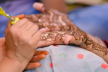 applying henna on hand, wedding ,Rajasthan, India