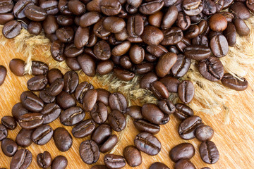 Fresh coffee beans on wood background