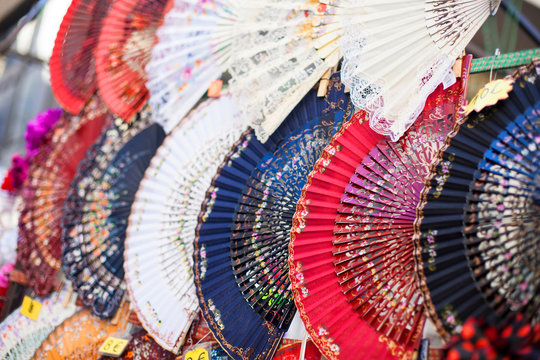 Colorful Spanish Fans arranged for sale in a store