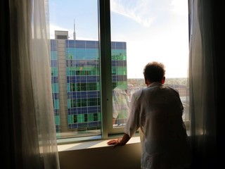 Aged asian woman is homesick