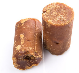 Brown coconut sugar over white background