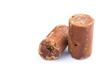 Brown coconut sugar over white background