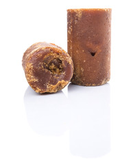 Brown coconut sugar over white background