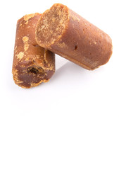 Brown coconut sugar over white background