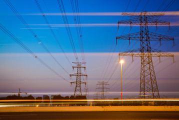 the high voltage electricity pylon in side of highway