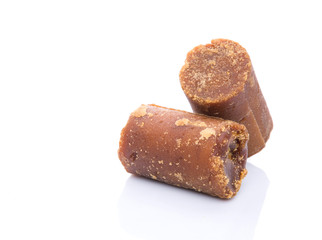 Brown coconut sugar over white background
