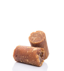 Brown coconut sugar over white background