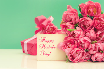 Mother's Day. Pink tulips, gift ang greeting card